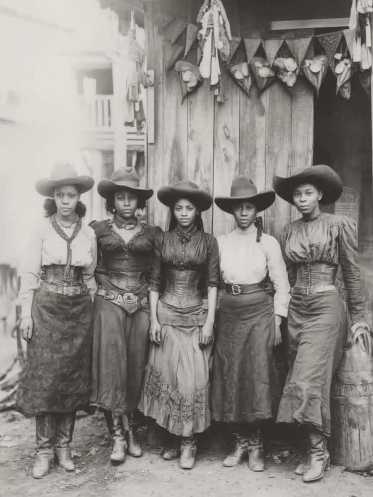 19th Century Fashion for Women: 8 Styles and Silhouettes 4 Five women wearing wide-brimmed hats and long skirts in vintage Western attire.
