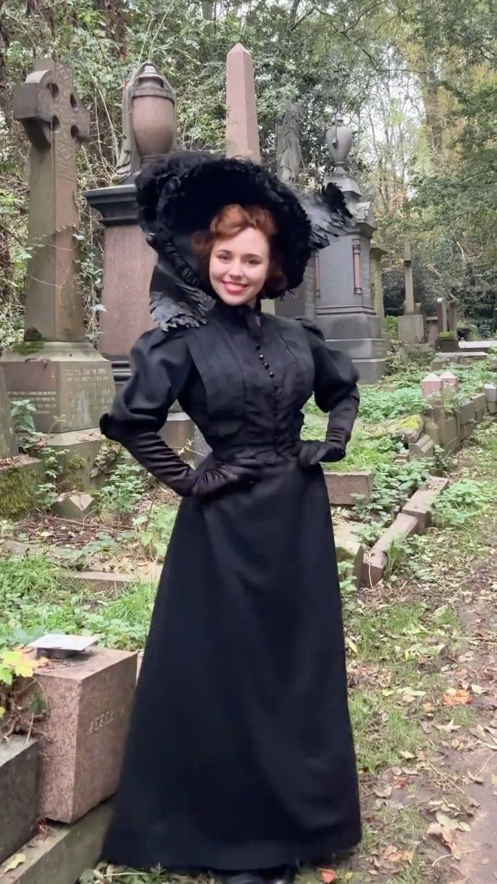 19th Century Fashion for Women: 8 Styles and Silhouettes 5 Woman in black 19th century mourning dress and hat posing in a cemetery