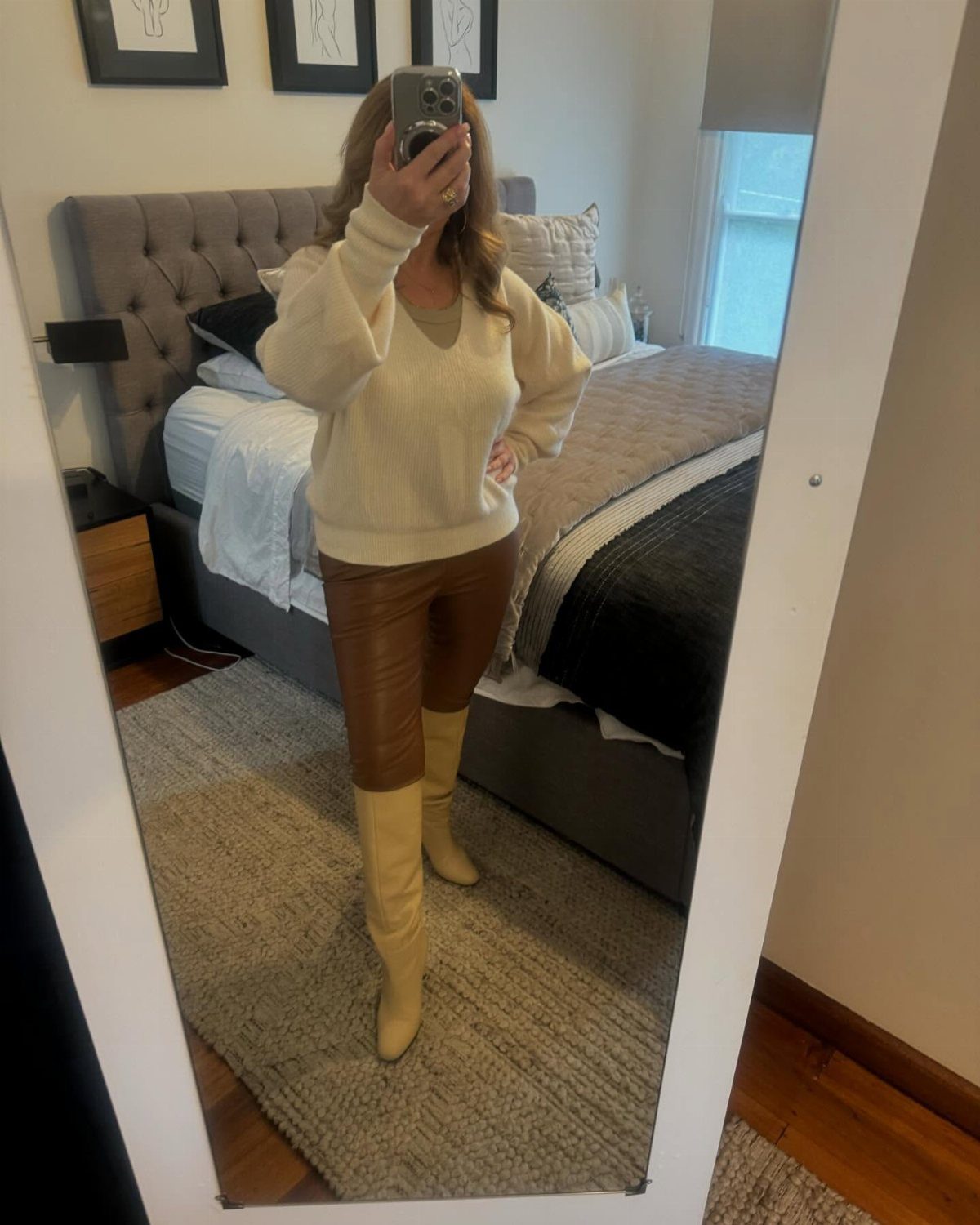 Black or Brown Boots for Every Outfit: 8 Ideas to Wear 8 Person in cream sweater and brown leather pants wearing tall tan boots.