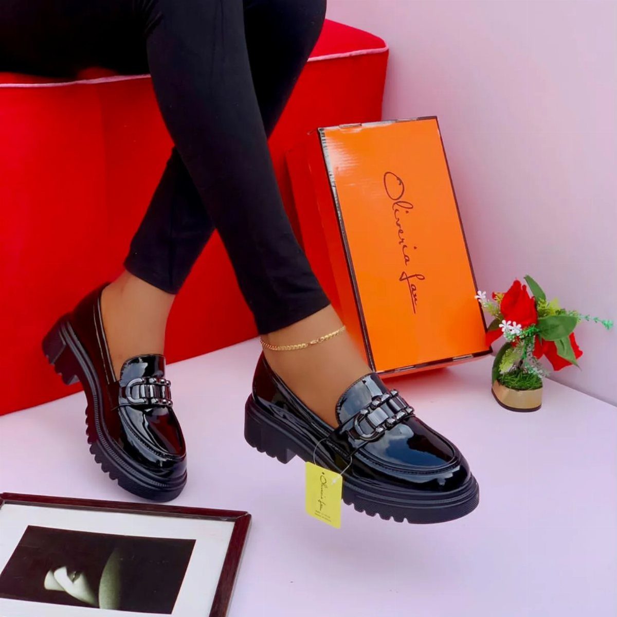 Career Fair Outfits for Women: 8 Ideas to Wear 8 Black patent leather chunky loafers with silver buckles worn with black trousers.