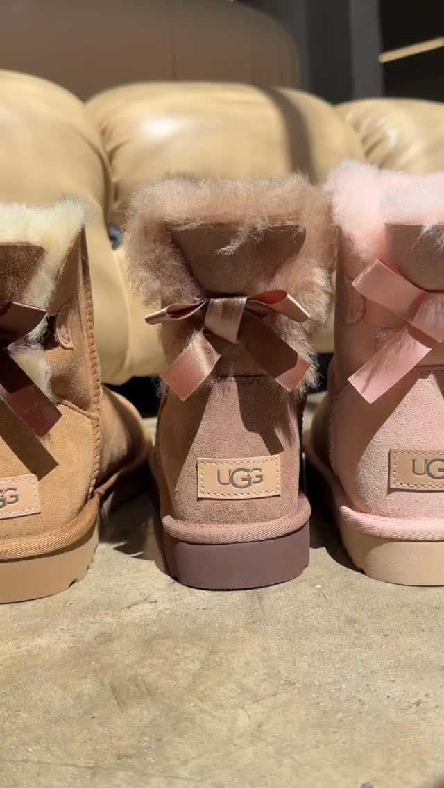 7 Different Types of Uggs for Every Season and Style 5 Three colorful UGG boots with bows and fur trim seen from behind.