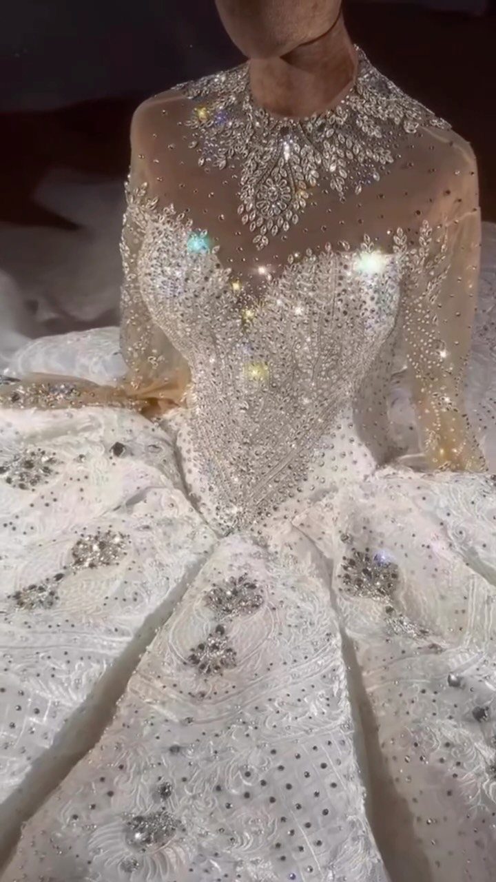 Fairy Tail Dress Ideas: 6 Styles for Fairytale Looks 1 White sparkling ball gown with crystal embellishments and a voluminous textured skirt.