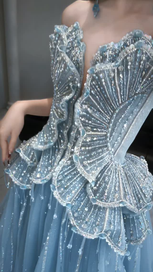 Dusty blue tulle gown with beaded scalloped ruffles on the bodice.