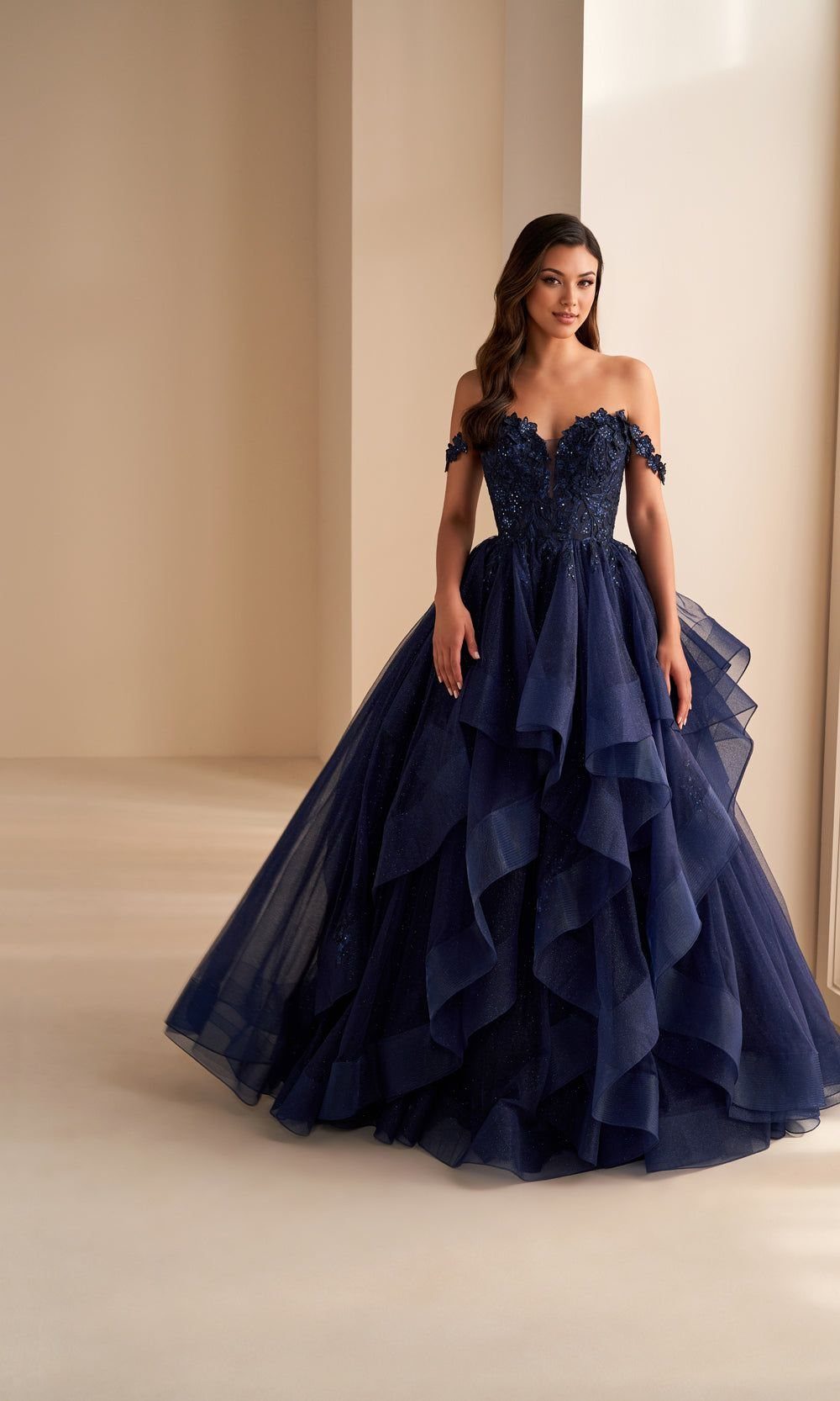 Navy Blue Ball Gown Ideas: 9 Styles From Tulle to Corset 5 Woman in navy blue ball gown with sweetheart neckline and layered tulle skirt