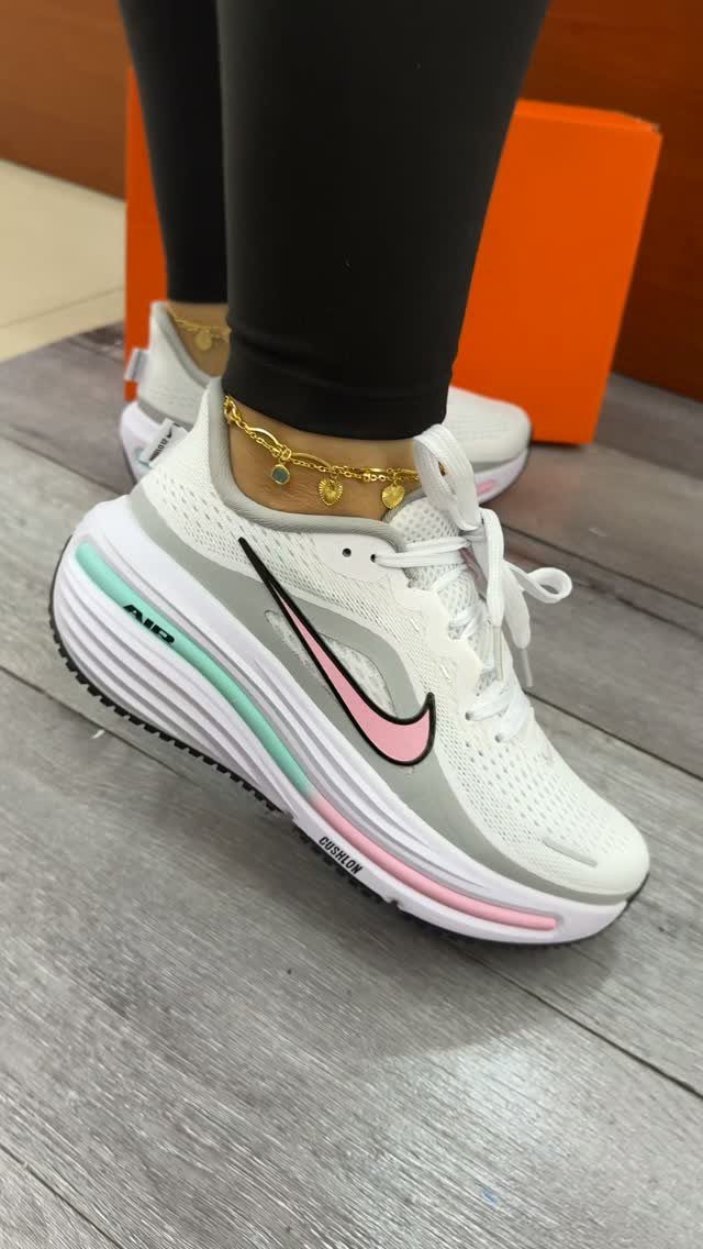 Nike Balance Shoes: 8 Sneaker Ideas for Women 6 White Nike athletic shoes with pastel accents worn with black leggings and gold anklet