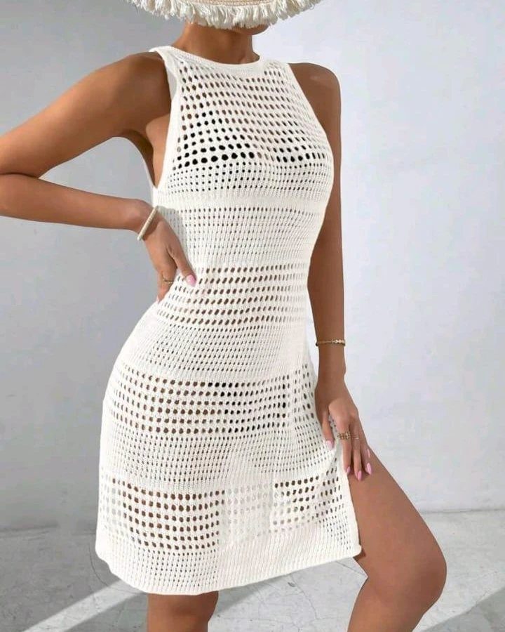7 Off White Boho Dress Ideas for Every Occasion 5 Woman wearing a short off-white crochet boho dress and a straw hat.