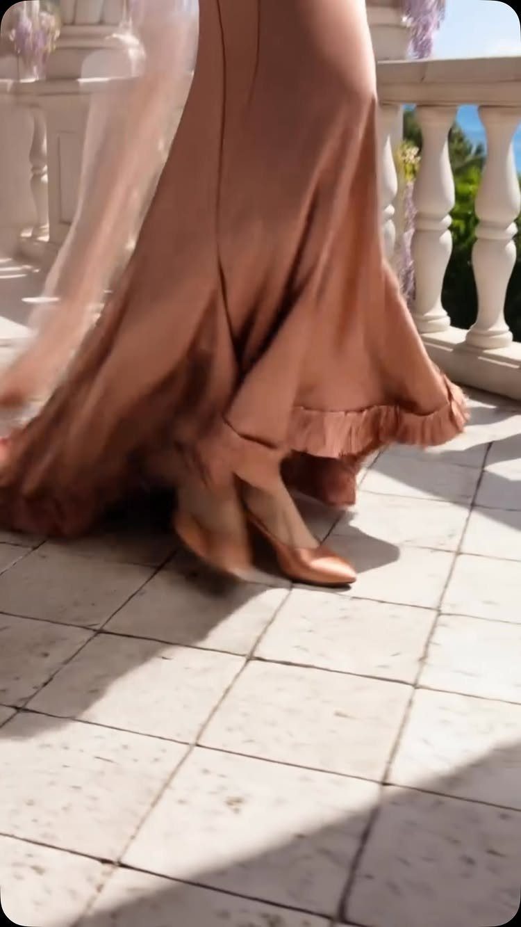 Old Hollywood Style Dresses: 9 Ideas in Satin, Lace and Black 8 Champagne satin gown flowing on a tiled terrace with white stone railings.