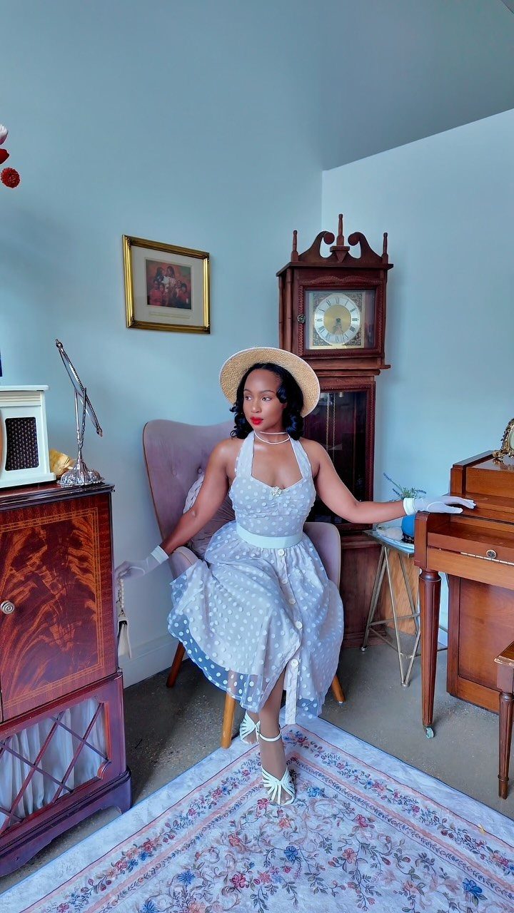 Old Hollywood Style Dresses: 9 Ideas in Satin, Lace and Black 2 Woman in a white polka dot halter dress and straw hat posing indoors.