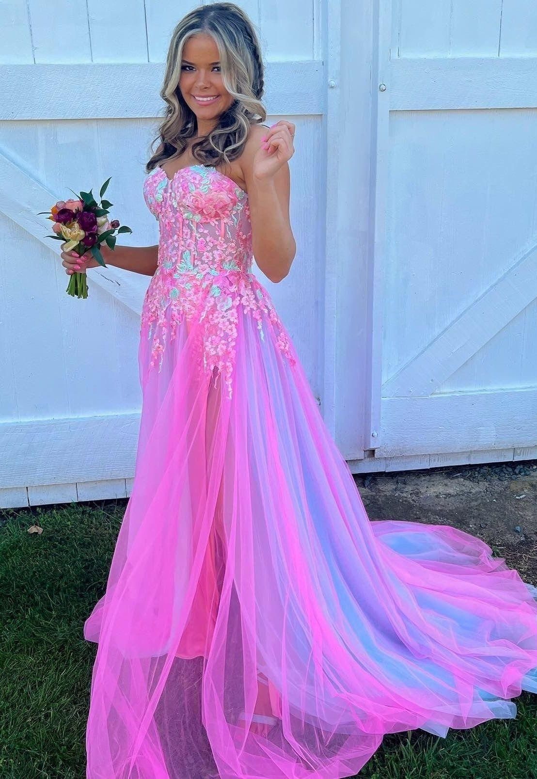 Pink and Blue Dresses: 7 Ideas for Every Style 2 Woman in a strapless pink and blue floral lace bodice gown with tulle skirt