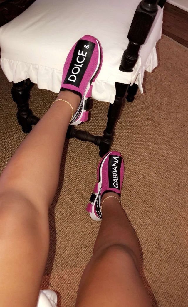 Pink and White Designer Sneakers: 5 Pairs for Women 3 Pink and white Dolce & Gabbana slip-on sneakers worn on a person's feet.