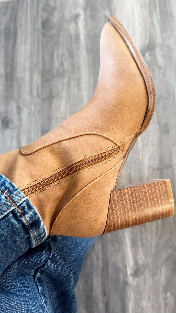 Tan brown leather ankle boot with a block heel and pointed toe.