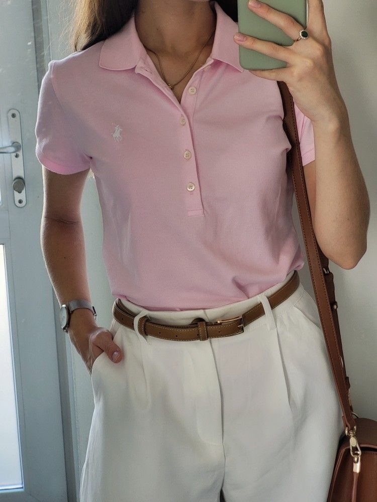 Ralph Lauren Polo Fits for Every Day: 10 Outfit Ideas 10 Person wearing a light pink polo shirt tucked into white trousers with brown belt.