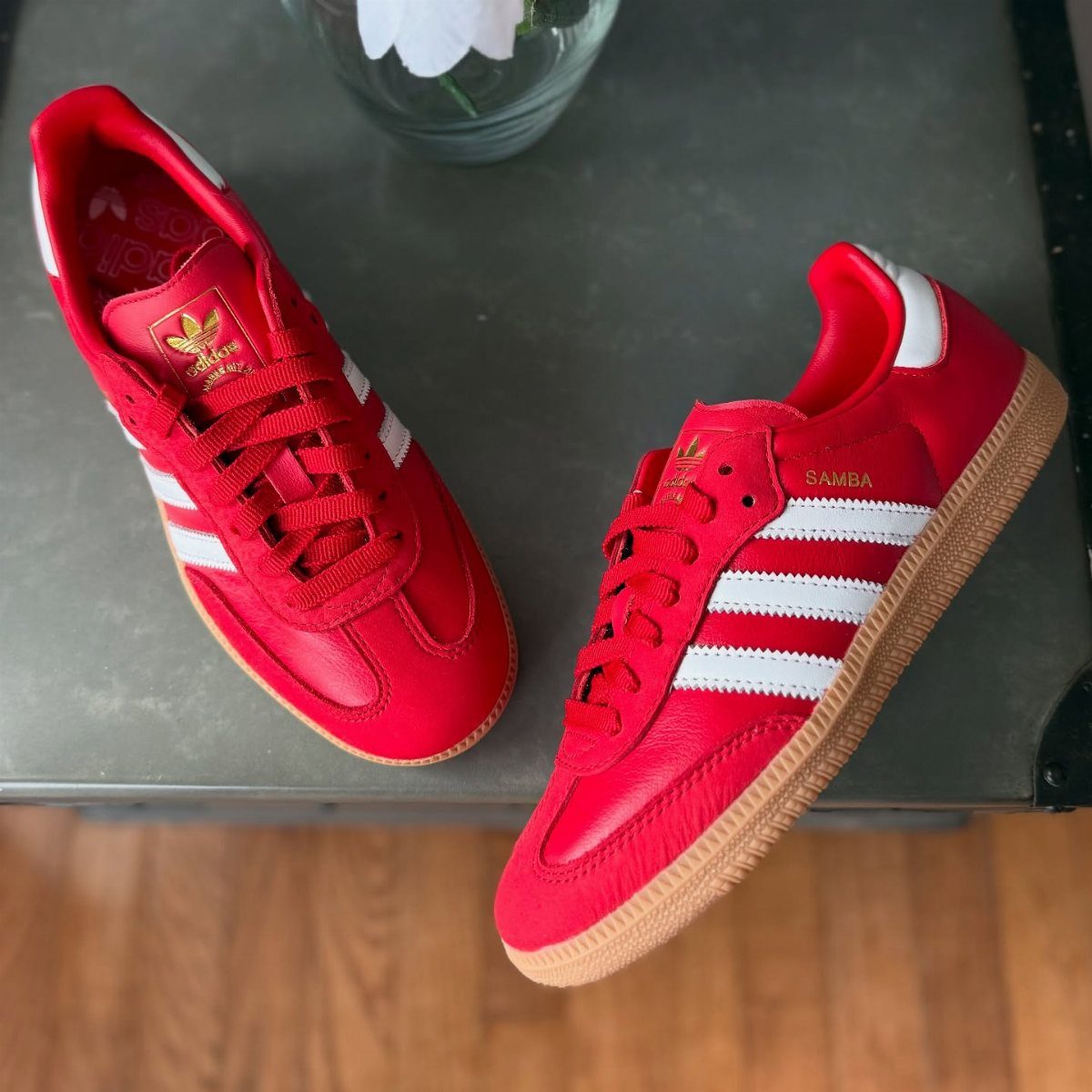 8 Red Trendy Shoes for Sneaker and Flat Lovers 8 Red Adidas Samba sneakers with white stripes and tan soles on a table