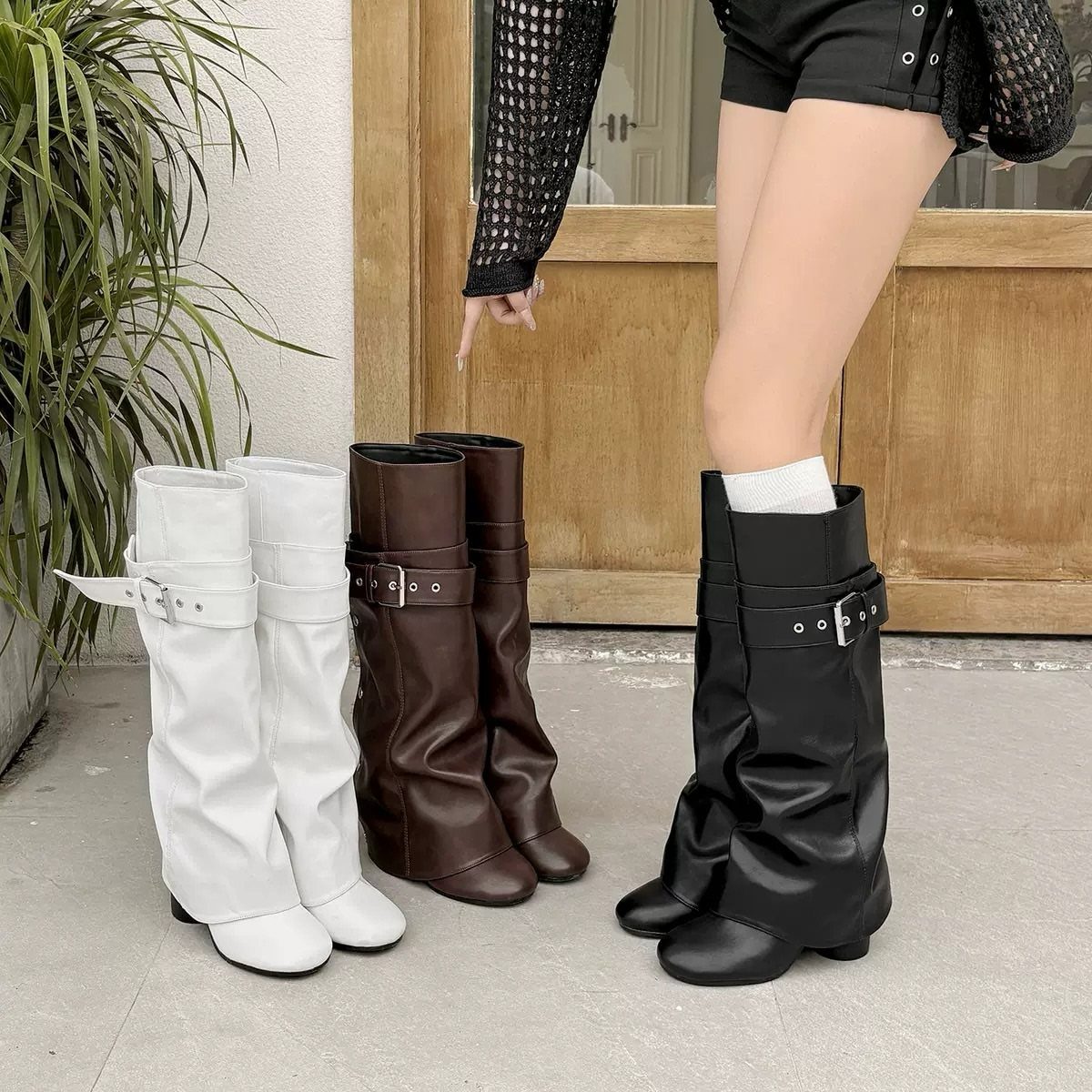 Scrunch Knee High Boots: 7 Ideas for Every Outfit 1 Slouchy knee high boots in white, brown, and black colors on a concrete floor.