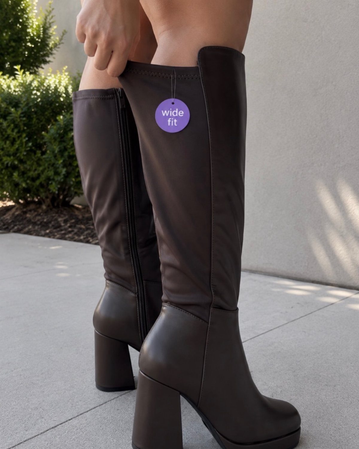 Shin High Boots: 5 Ideas from Suede to Wide Calf Styles 2 Dark brown wide calf boots with block heels and a wide fit tag.