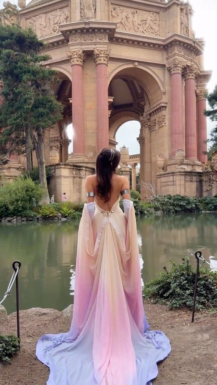 Star Wars Prom Dress Ideas: 3 Gowns From Vader to Padme 2 Woman in a flowing pastel iridescent gown standing before a classical stone archway.